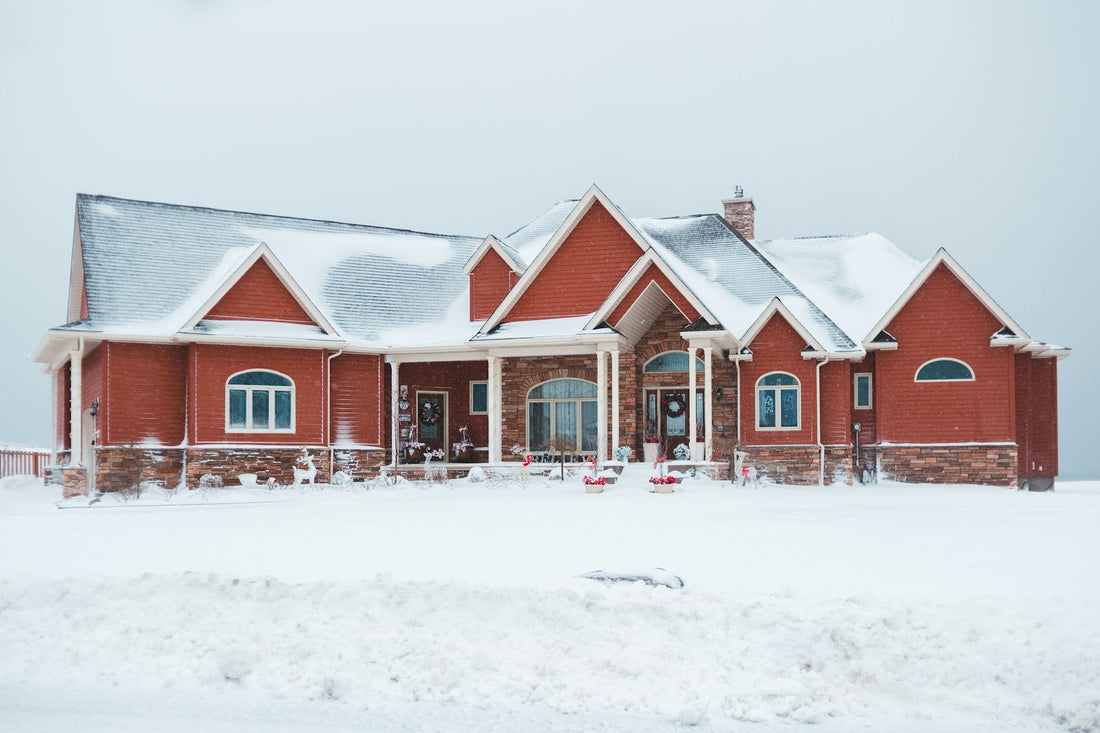 Brick ranch home and front yard covered in fresh snow