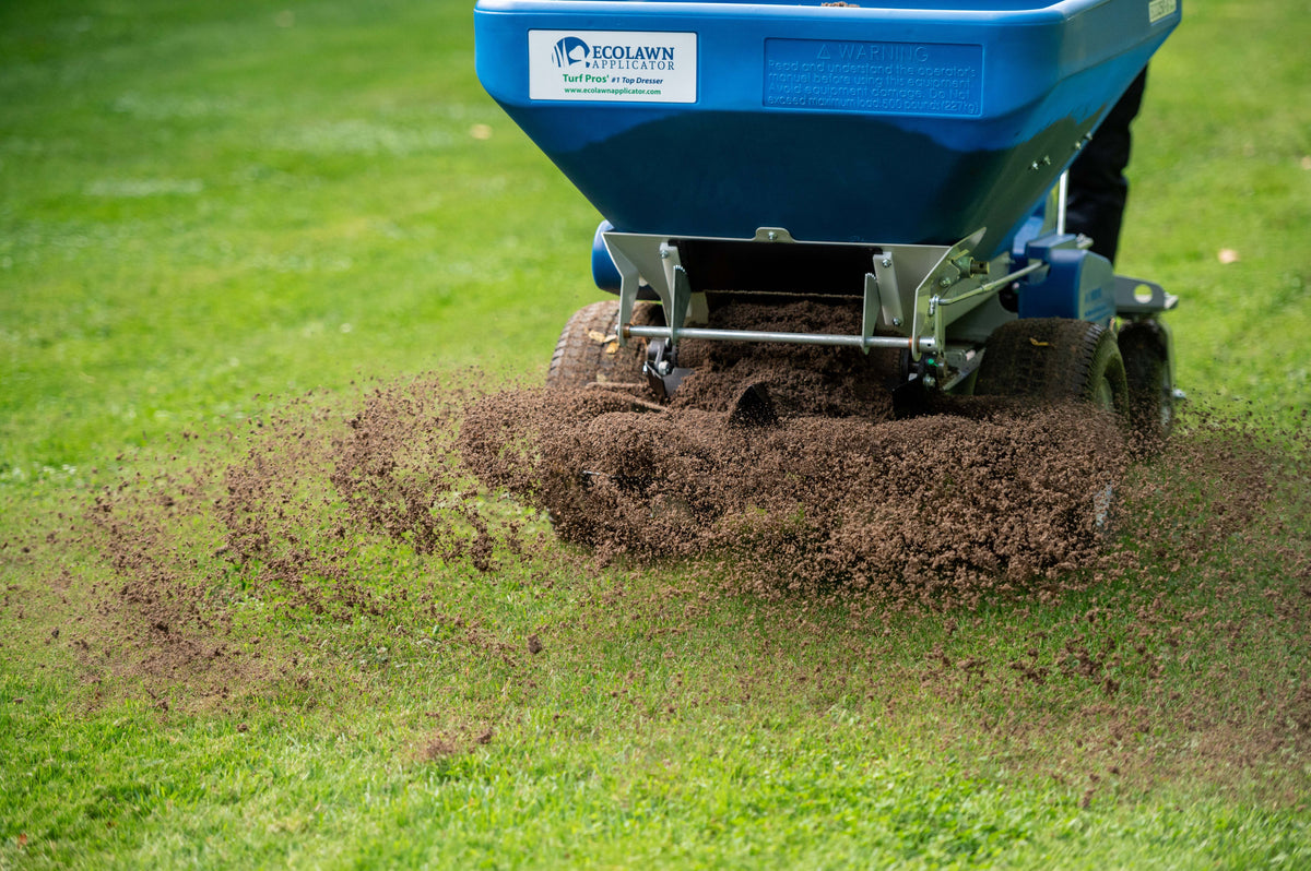 EcoLawn topdresser spreading screened compost across a lawn
