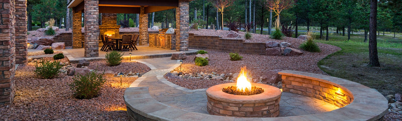 Stone fire pit on a paver patio